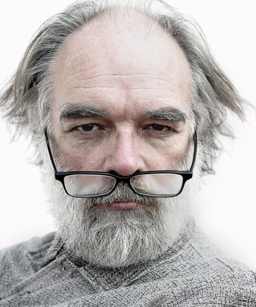 closeup shot of a man with glasses