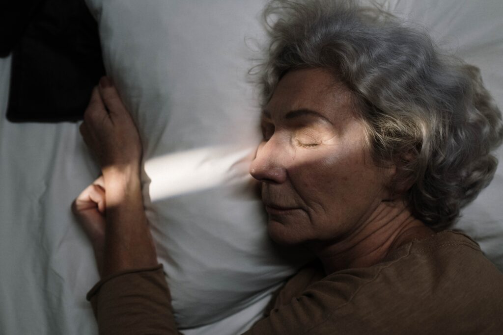 closeup shot of an elderly woman sleeping