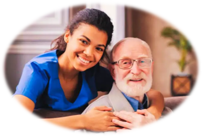 Smiling caregiver hugging an elderly man.